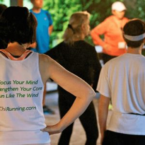 Group performing pre-run exercises