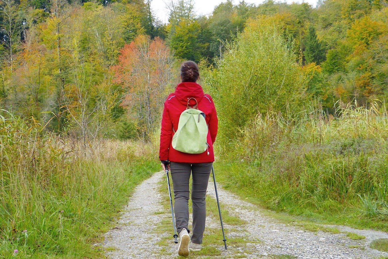 woman walking on trail outside