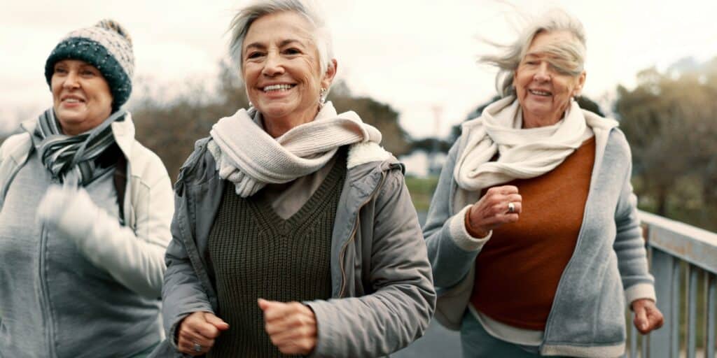 3 senior woman chiwalking on a rec path
