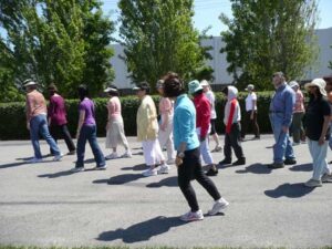 large group of people learning chirunning body sensing