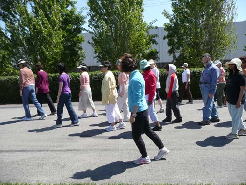 large group of people learning chirunning body sensing