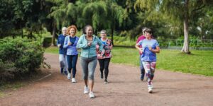 seniors chirunning in a park on a dirt path